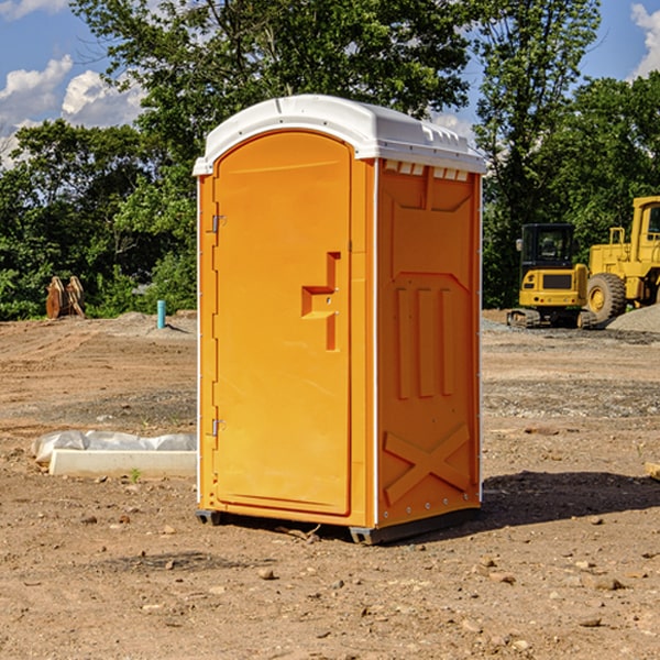 what is the cost difference between standard and deluxe portable restroom rentals in Clay